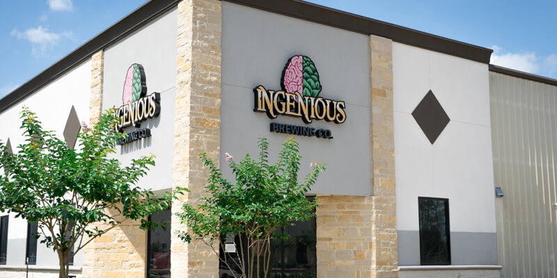 Front Of The Ingenious Brewing Co. Building With Logo Display